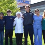 Polaris Learning Center Welcomes Students: Student ambassadors stand outside the modern Polaris Career Center building, symbolizing a welcoming and career-focused learning environment.