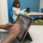 Students and teachers interacting at Hill Learning Center