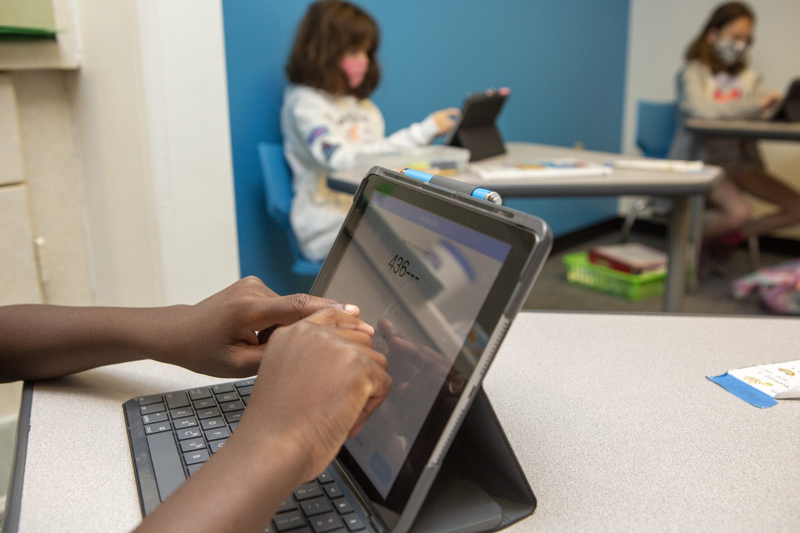 Students and teachers interacting at Hill Learning Center