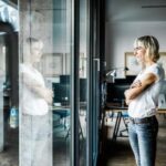 Modern Businesswoman Standing in her Office