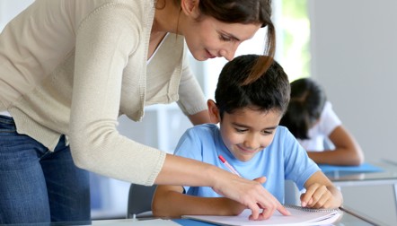 Educators using Acadience Reading assessment tools with a student