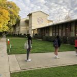 Students excitedly return to school after pandemic closures, ready for zingy learning experiences.