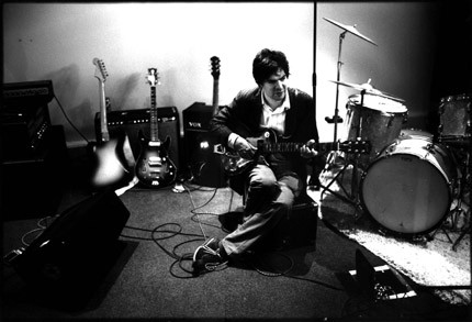 Jon Brion, the producer criticized for his work on Beck's cover of 'Everybody's Gotta Learn Sometime', pictured with a variety of instruments.