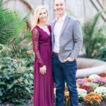 Jenna and Logan pose elegantly in front of the Cathedral of Learning's stone facade during their engagement photoshoot.