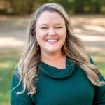 Director Charlotte Bramlett warmly smiles in a close-up shot, embodying approachable leadership at Bethel Learning Center.