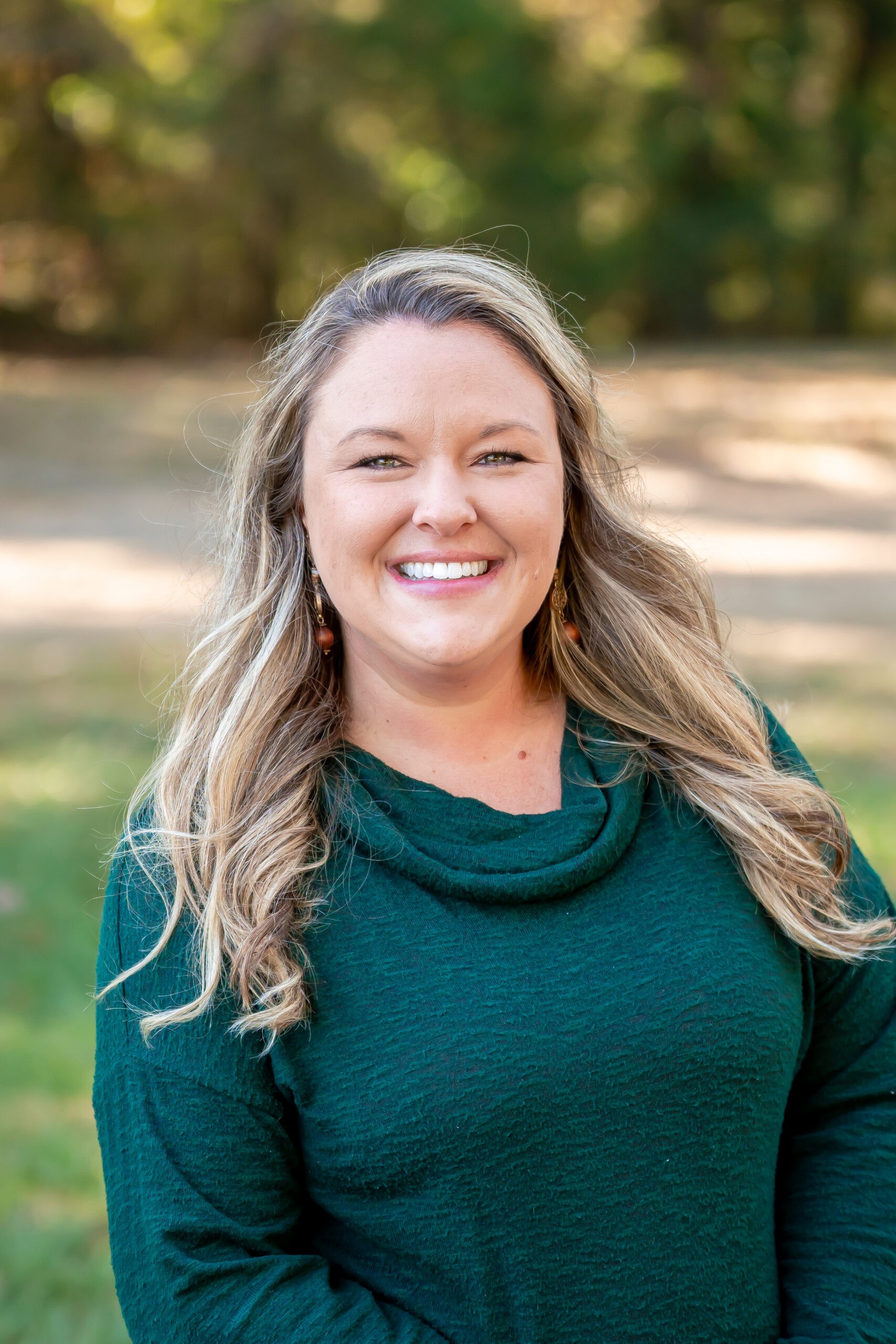 Director Charlotte Bramlett warmly smiles in a close-up shot, embodying approachable leadership at Bethel Learning Center.