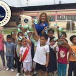 Rossana Chiarella and students in Patapo School in Peru.