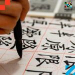 Person practicing Mandarin Chinese writing, representing the effort and reward of learning the best language for business in China.