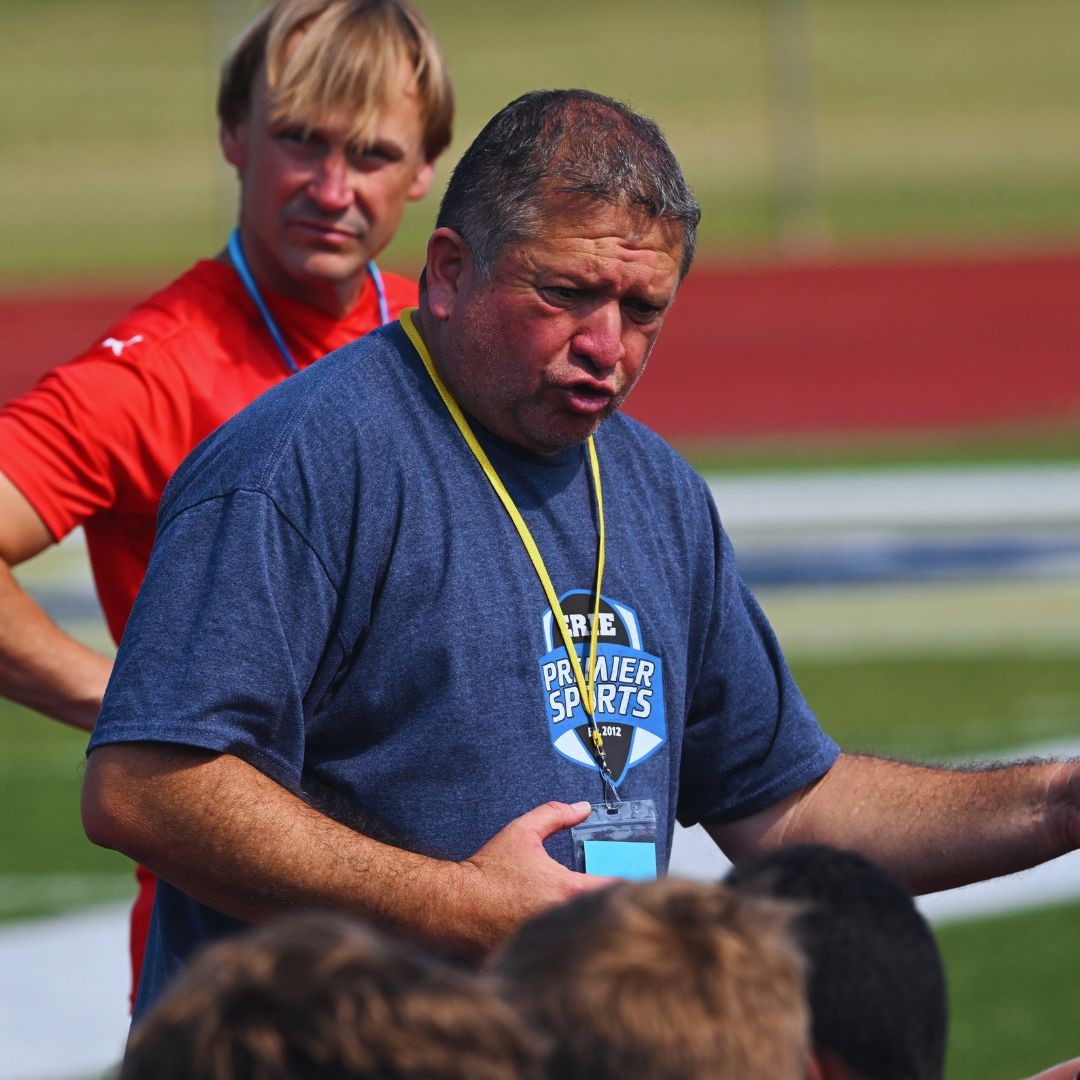 Youth soccer coach instructing players during a practice session at PA West Learning Center