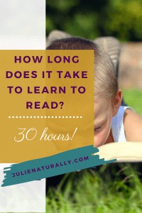 Young boy engrossed in reading a book outdoors, illustrating the concept of learning to read and the time investment involved.