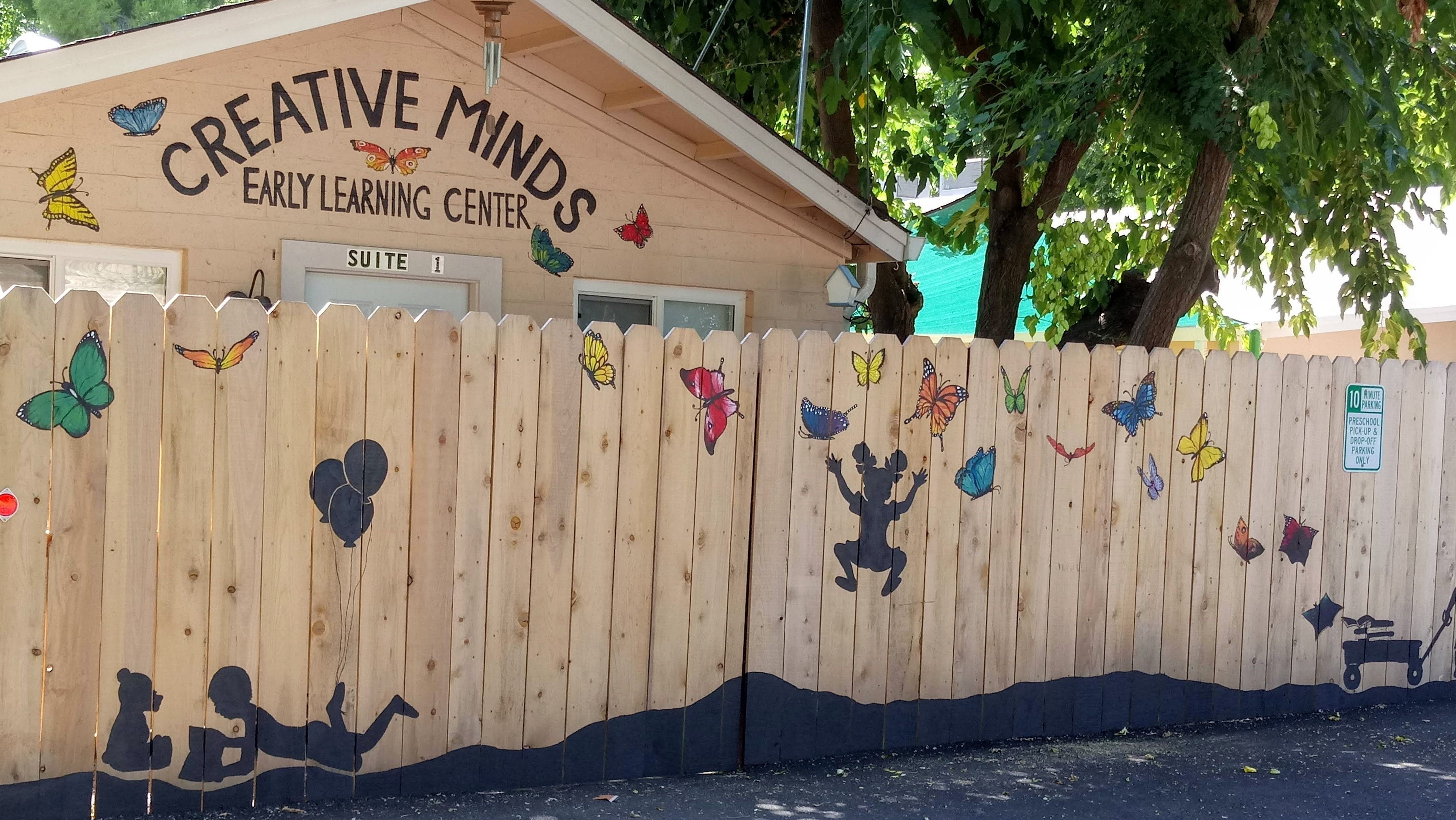 Children joyfully engaging in play-based learning activities at Creative Minds Early Learning Center