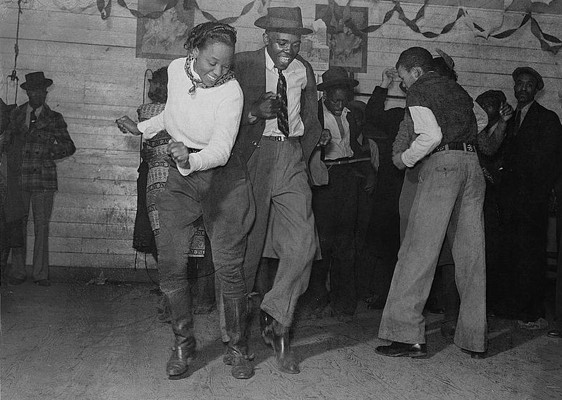 Two dancers jitterbugging at a juke joint, November 1939 via wikimedia