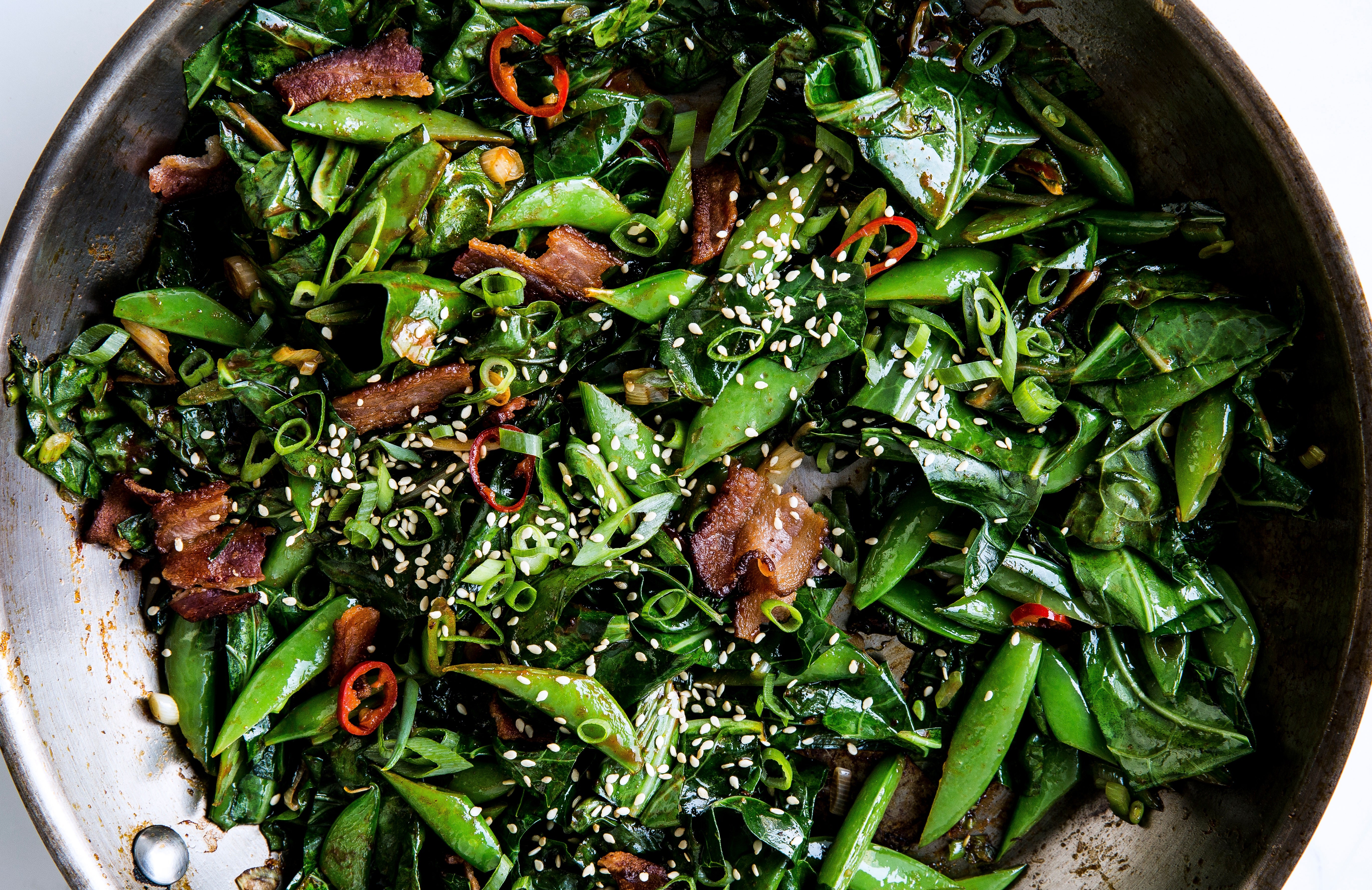 Roasted vegetables in a pan, seasoned with herbs and spices