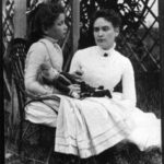 Helen Keller with Anne in 1888 in a garden setting