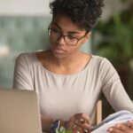 Woman studying online, highlighting the benefits of online learning for accessible education.