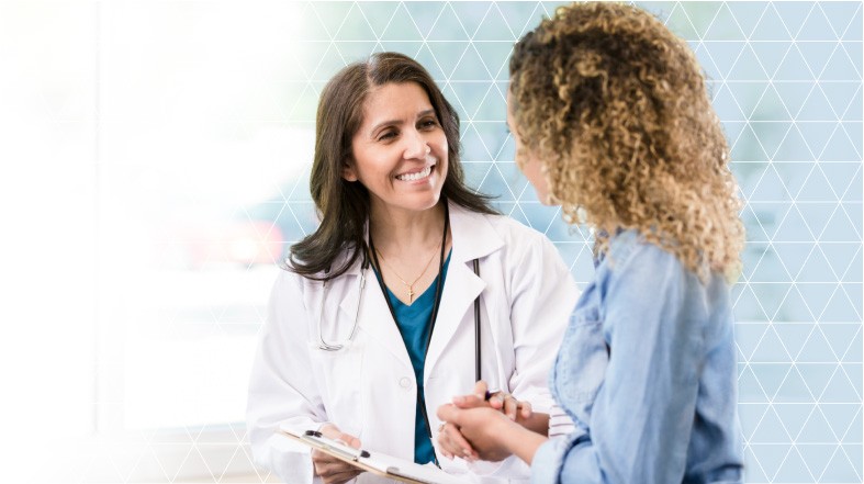 A doctor reviewing medical images on a monitor with a colleague, highlighting the collaborative and advanced nature of Imagen's diagnostic services.