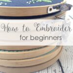 Embroidery supplies for beginners laid out on a table