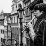 A lady playing the Recorder in the street