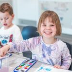 Smiling children engaging in learning activities