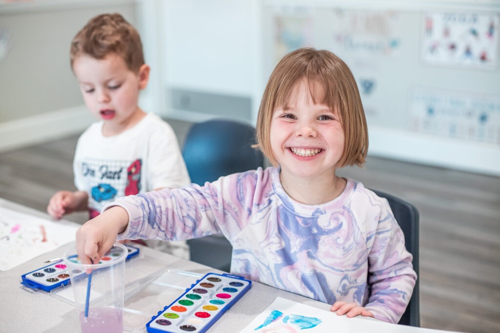 Smiling children engaging in learning activities