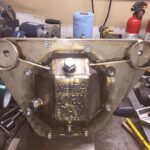 Close-up of a beginner's MIG weld, showcasing the fusion of two metal pieces.