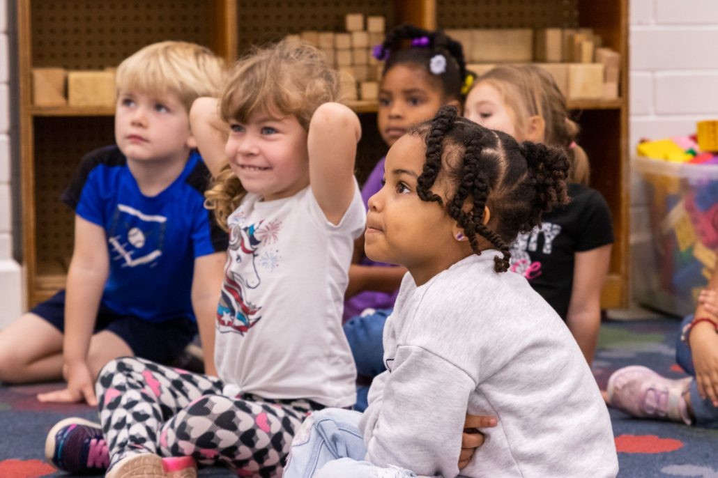 Children engaging in learning activities in a classroom setting, highlighting the importance of early childhood education.