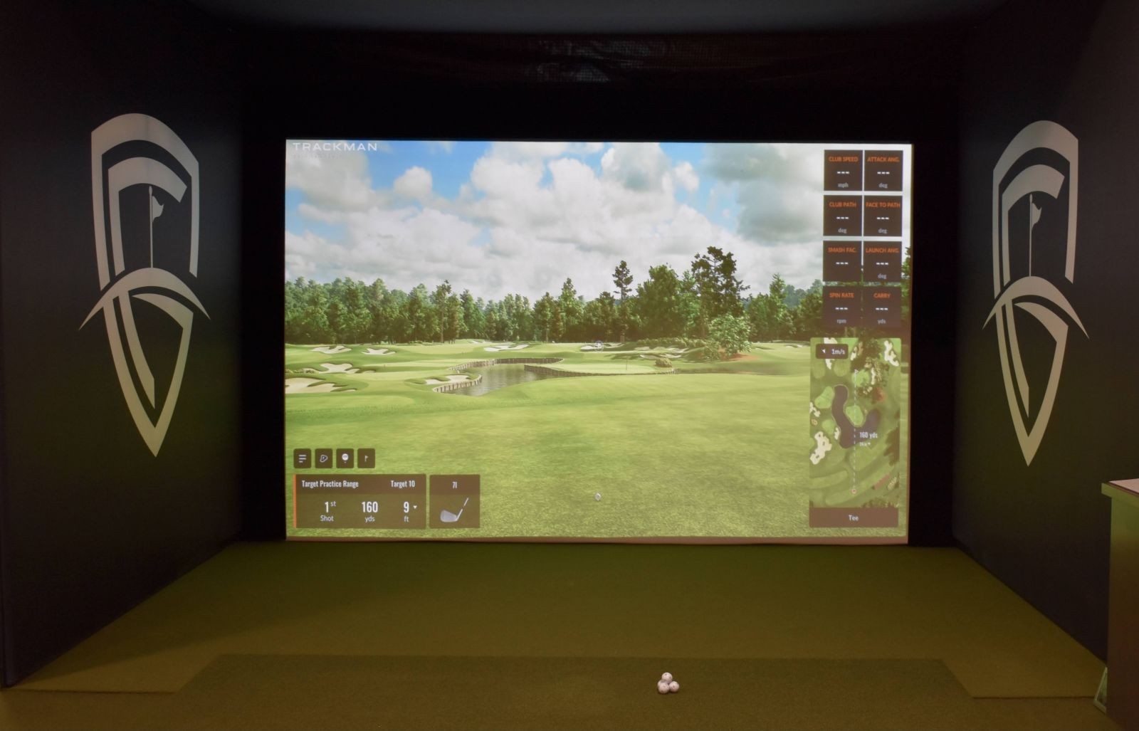 A close-up view of a TrackMan simulator screen displaying detailed golf performance data in a practice room, emphasizing the technology's role in golf improvement.