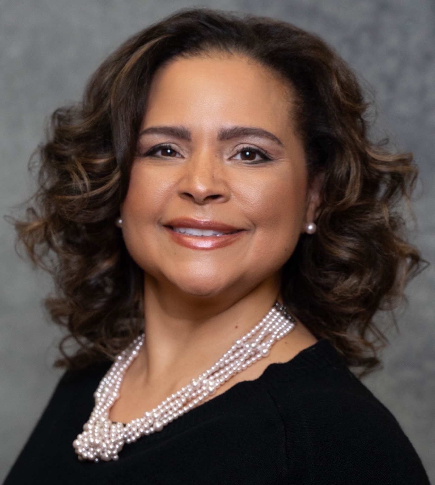 Sabrina Williams, Founder, Executive Director, CEO of Excell Academy for Higher Learning, smiling professionally in a headshot.