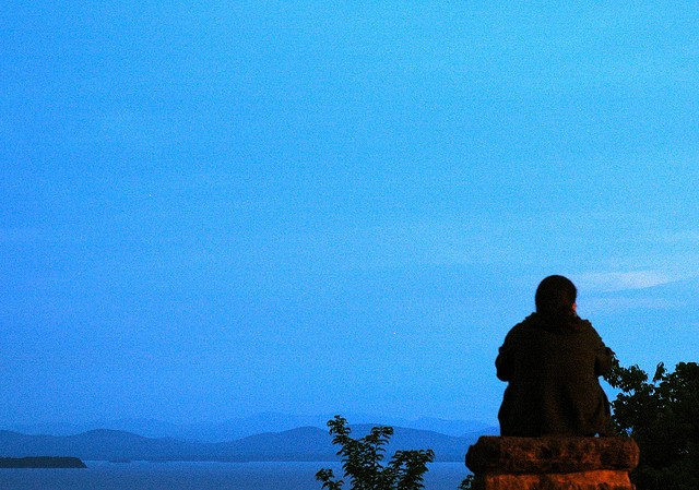 Contemplative figure sitting peacefully, embodying self-reflection and personal growth