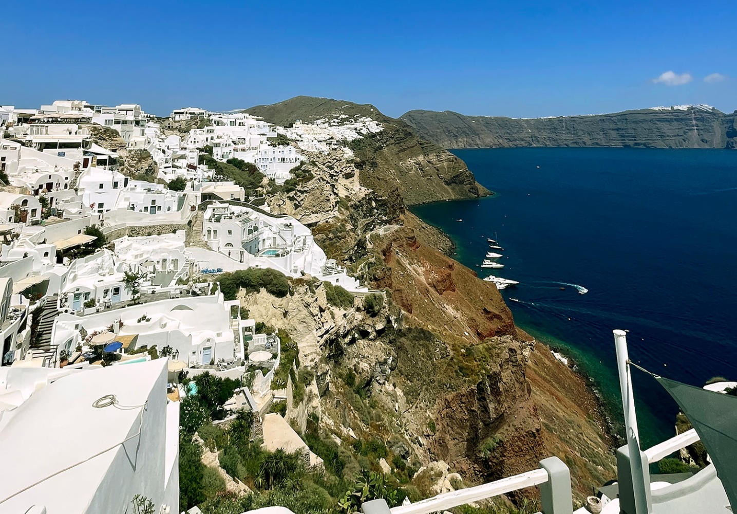 Santorini's iconic shoreline attracts visitors eager to learn about Greece's stunning landscapes.