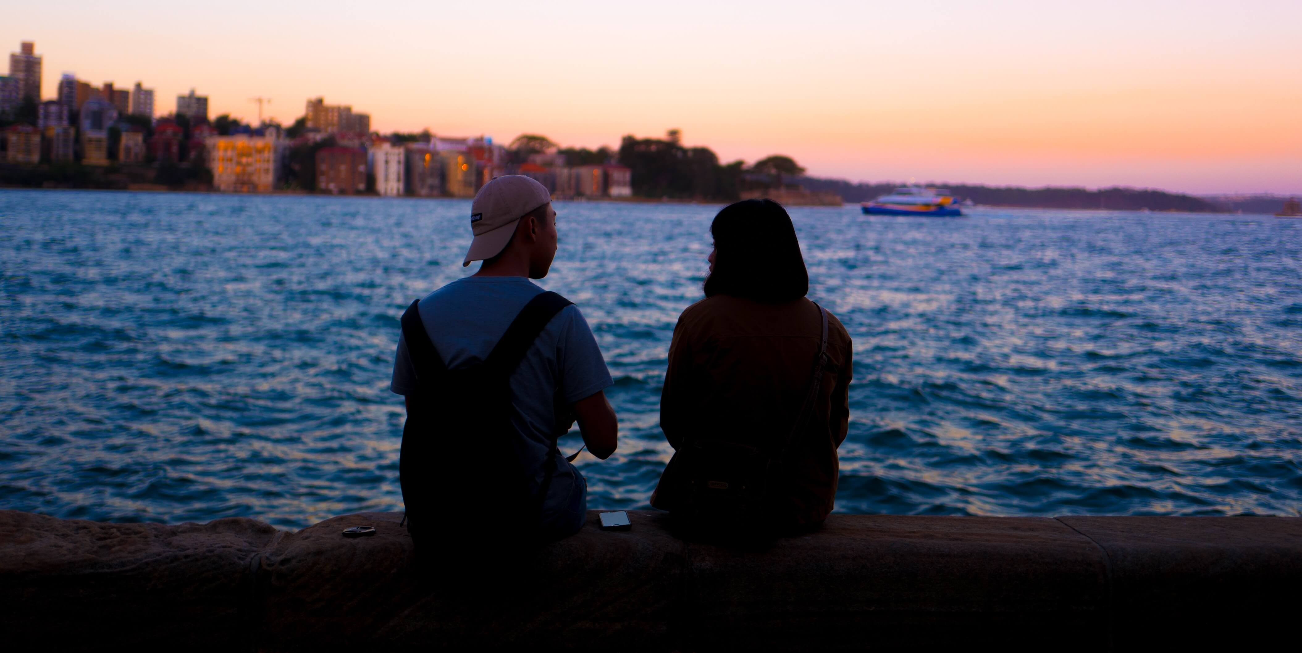 Couple facing away from each other, representing the silent treatment in relationships.