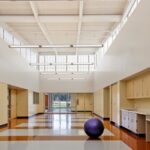 Interior perspective of Brokaw Early Learning Center showcasing the 9-foot horizontal design element and child-friendly scale