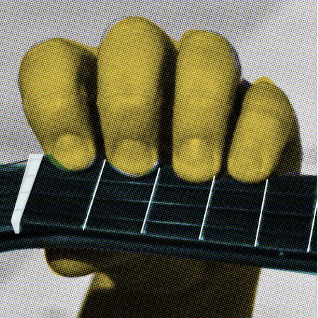 Hand holding a ukulele neck