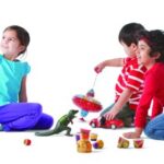 Children engaging in playful learning activities at a YMCA Early Learning Center, highlighting the nurturing environment for early childhood development.