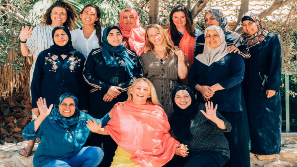 Women meeting at Iraq Al-Amir Women, showcasing the importance of connections and friendship.