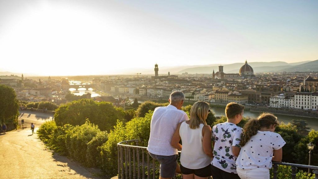 Family looking over a city, appreciating the moment and each other's company.