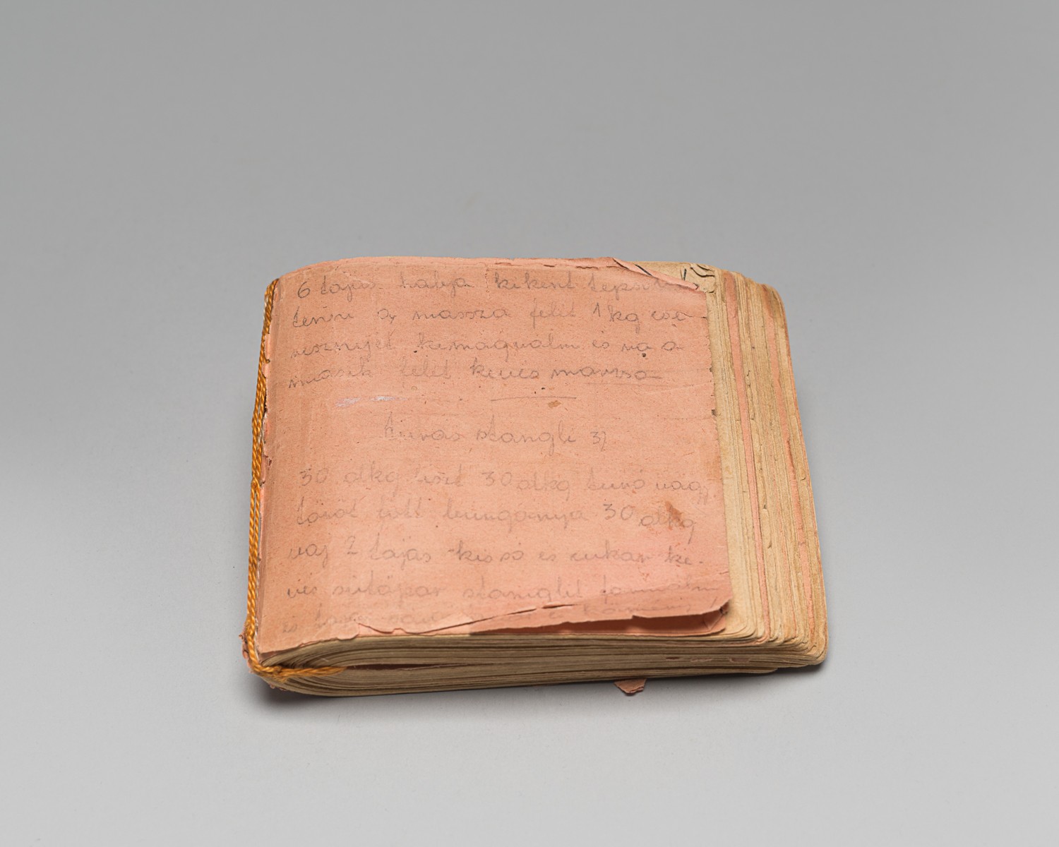 Book of recipes made from scraps of paper by Edith Gluck in Lippstadt camp.