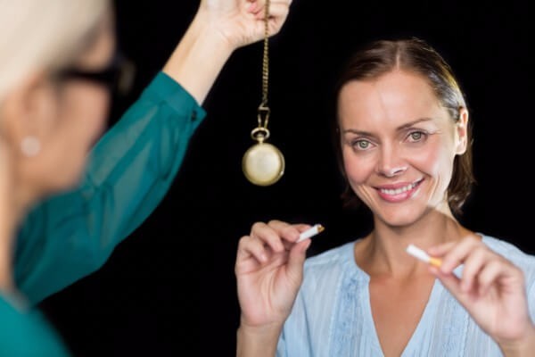 Woman quitting smoke with hypnosis