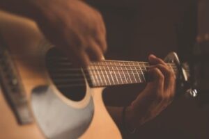 Close up of someone playing a guitar