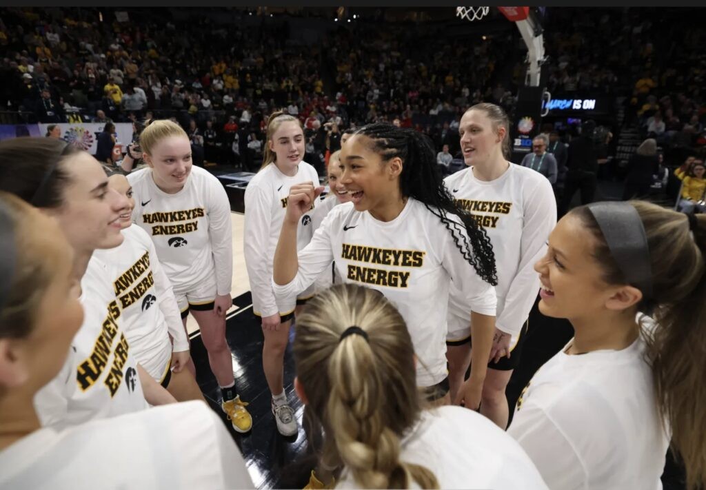 Iowa Hawkeyes women's basketball team celebrating a win