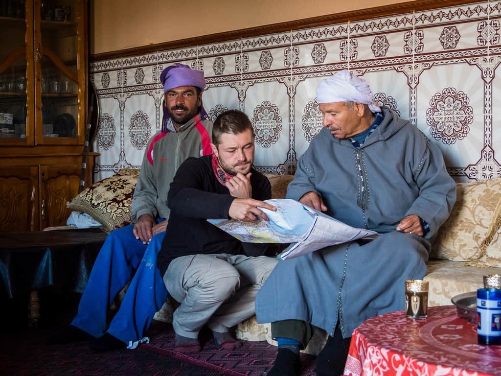 Studying map - talking with Moroccan people - hitchhiking in Morocco