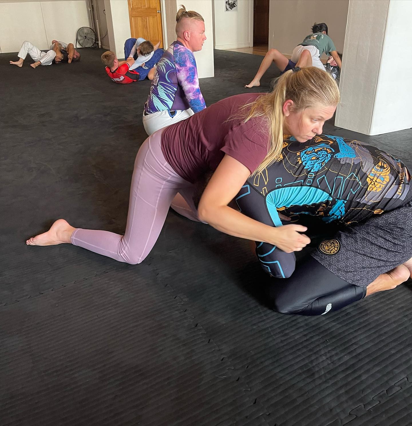 Woman practicing Jiu Jitsu with confidence