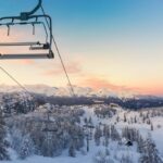 Adult beginner learning to ski, emphasizing determination and joy
