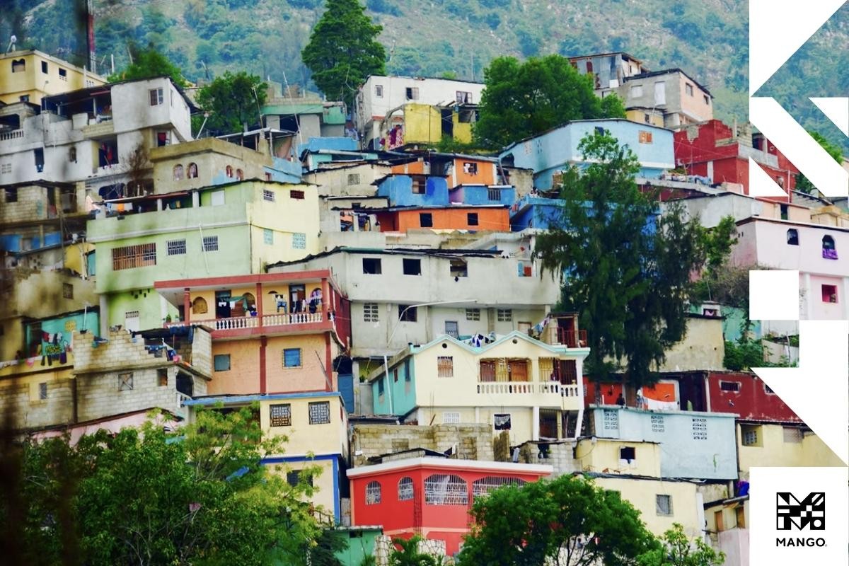 Colorful houses on a hill in Haiti, depicting the vibrant culture and community