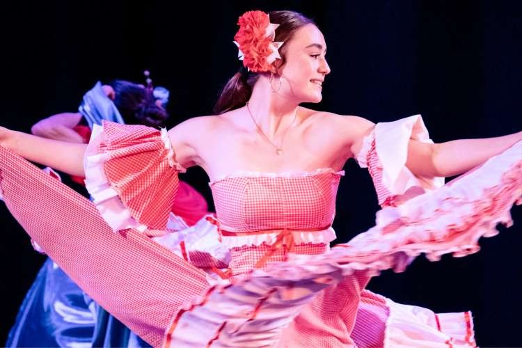 Cumbia dance performance at a cultural festival