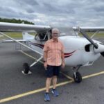 David Smith next to airplane