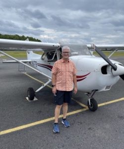 David Smith next to airplane