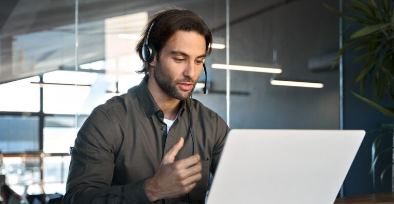 Adult male student is focused on learning difficult german words while sitting at desk