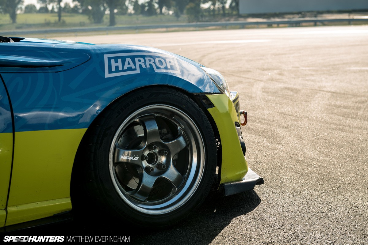 Attendees gathering at a Formula Drift event, showcasing the drifting community