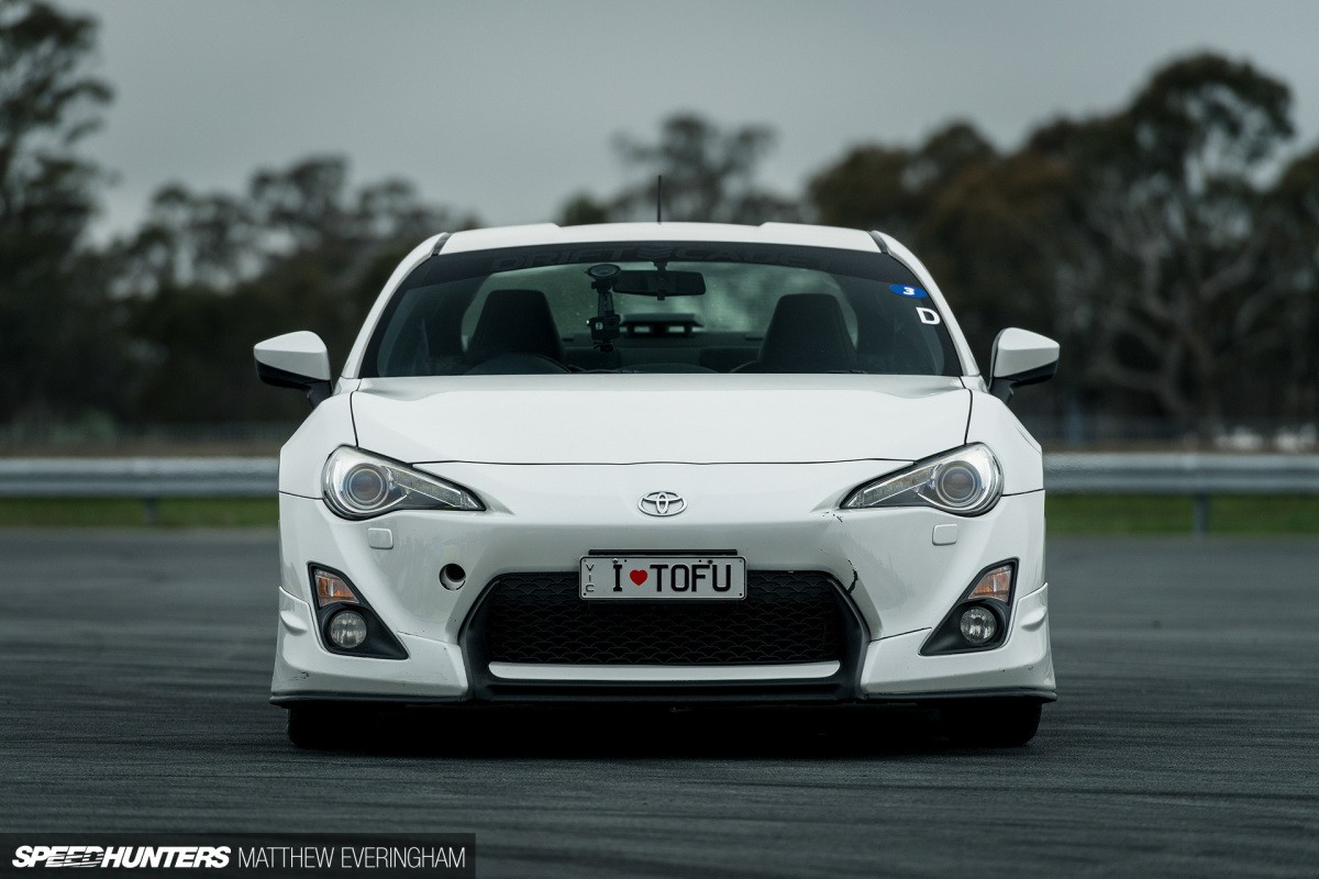Formula Drift driver competing in a professional event, showcasing drifting as a career